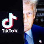 TikTok logo on screen with mans face behind