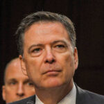 Man in suit looking serious at event