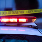 Police lights with caution tape in background