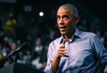 Elite Privilege EXPOSED: Obama Campaign Money Scandal Erupts A speaker gesturing while addressing an audience