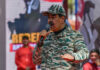 $50M Reward: Maduro’s Birthday Bombshell Man in camouflage uniform speaking at event outdoors