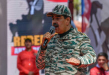 $50M Reward: Maduro’s Birthday Bombshell Man in camouflage uniform speaking at event outdoors