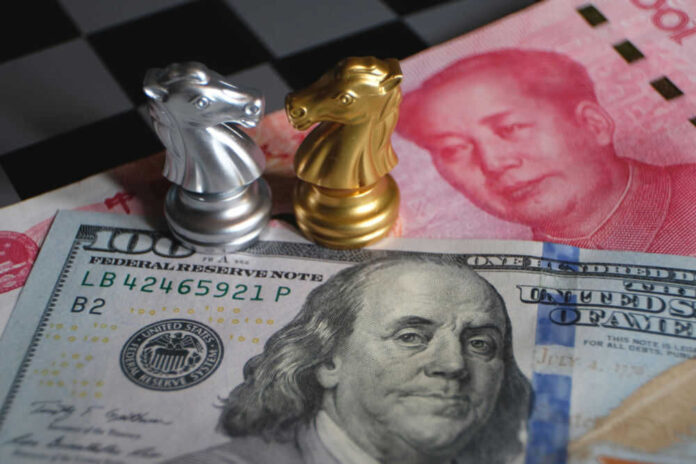 Silver and gold chess knights on currency notes