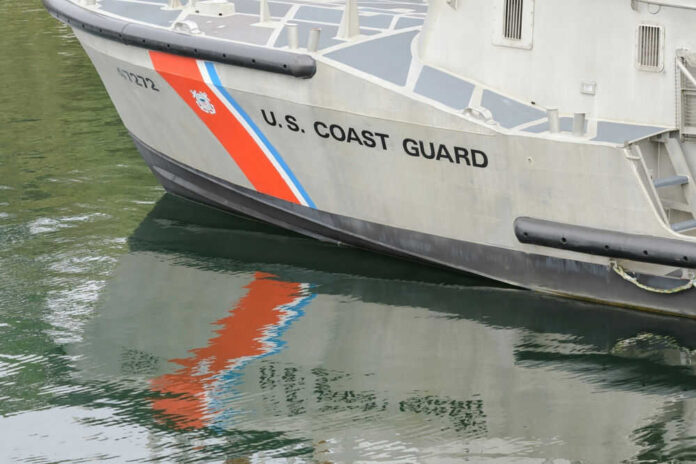 Coast Guard boat with reflection in water