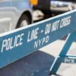 Blue police barricade with do not cross text