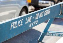 Blue police barricade with do not cross text