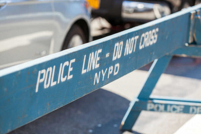 Blue police barricade with do not cross text
