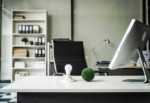 Office desk with computer and lightbulb decoration