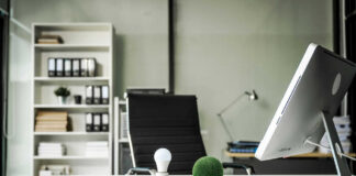 Office desk with computer and lightbulb decoration